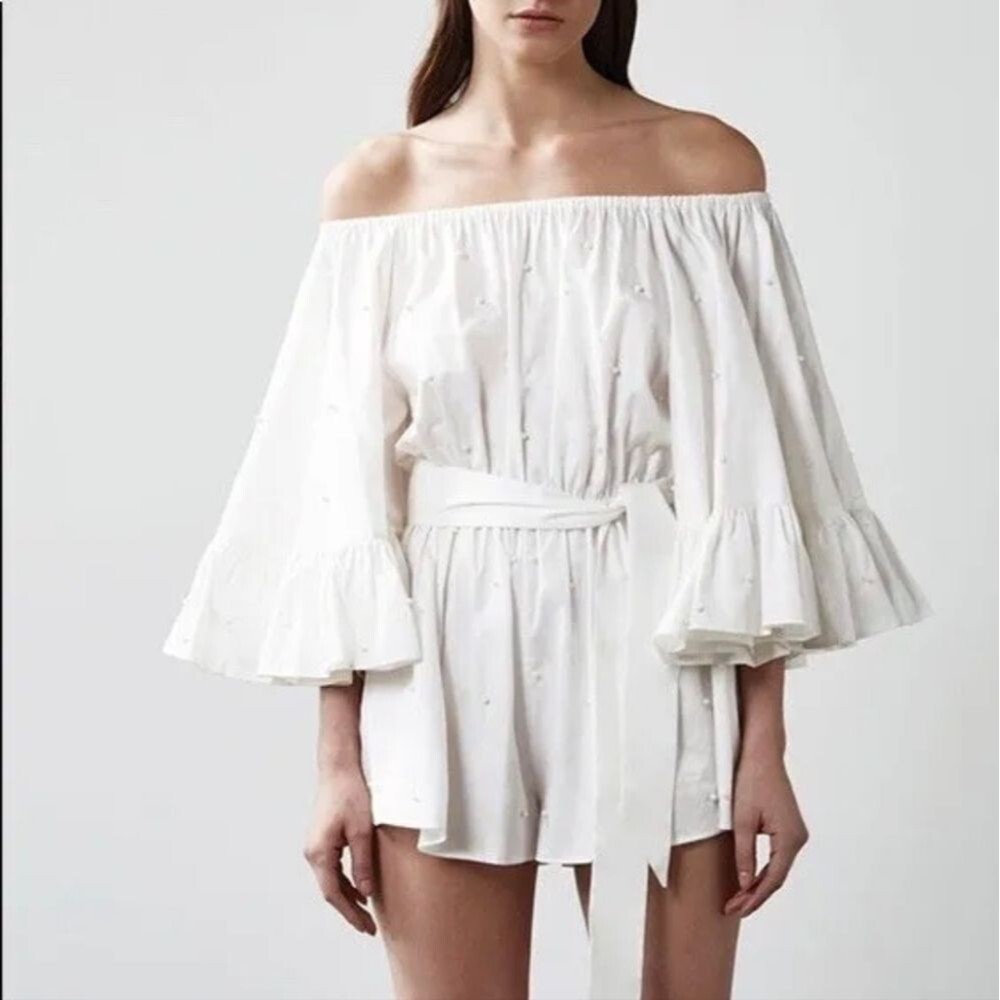 C/MEO pearl white romper shorts with bell ruffle sleeves M